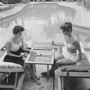Slim Aarons "Backgammon By The Pool" Photograph